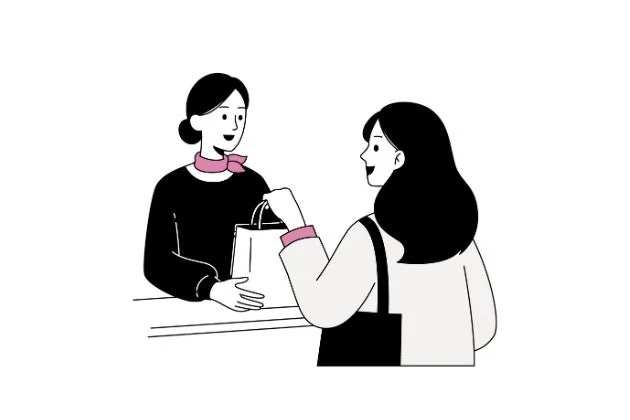 店員が客に商品が入った買い物袋を手渡しているイラスト